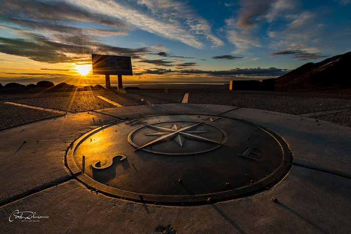 Compass and sunset at Glen Alps overlook in summer. 
